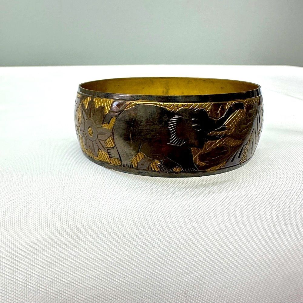 elephant‎ bangle. pattern repeated 3 times around band. 2.75 inch diameter